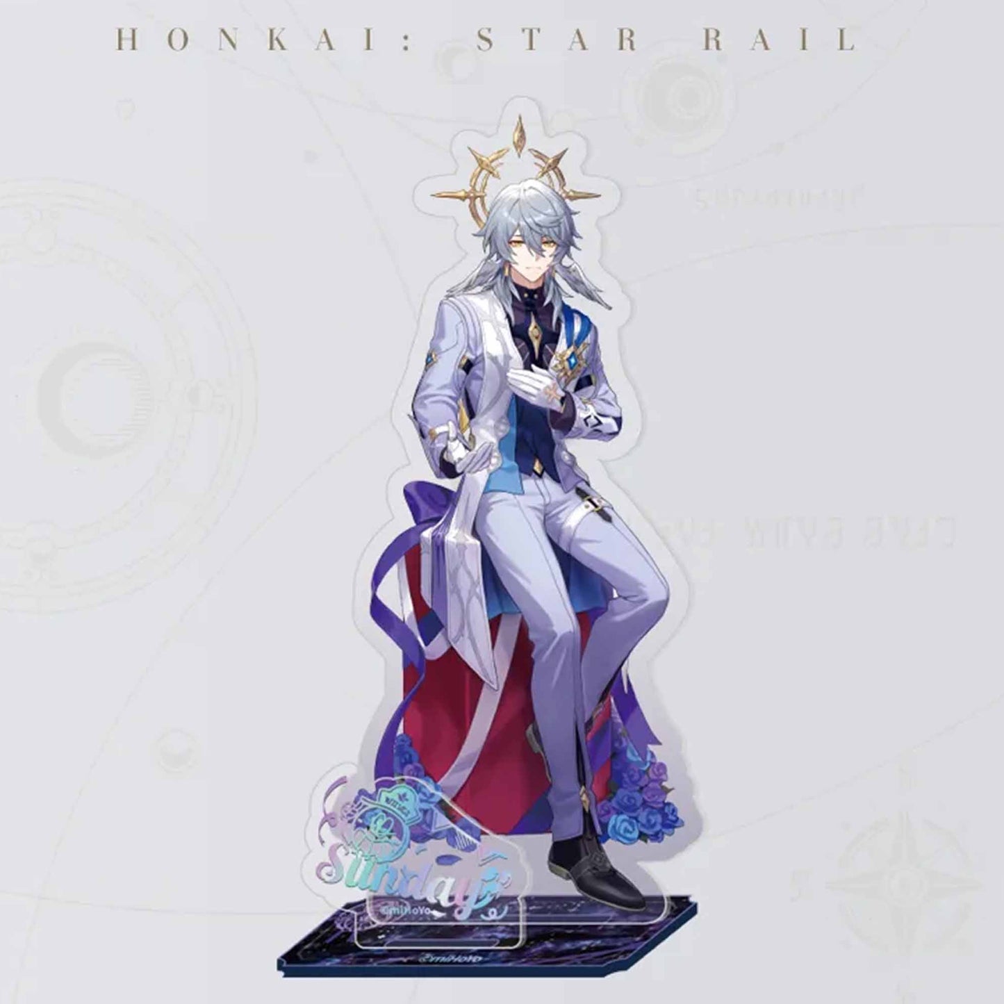 An acrylic stand of Sunday from Honkai: Star Rail, dressed in an elegant light purple suit with a golden halo, set against a decorative base with his holographic name.