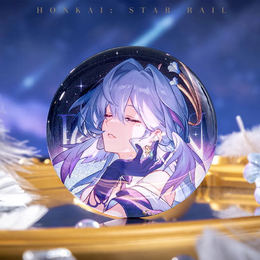 The Herta badge is showcased against a deep blue cosmic backdrop with shooting stars, resting on a reflective golden surface. Its silver glitter base shimmers, complementing Herta’s dreamy, closed-eye expression and flowing purple hair.
