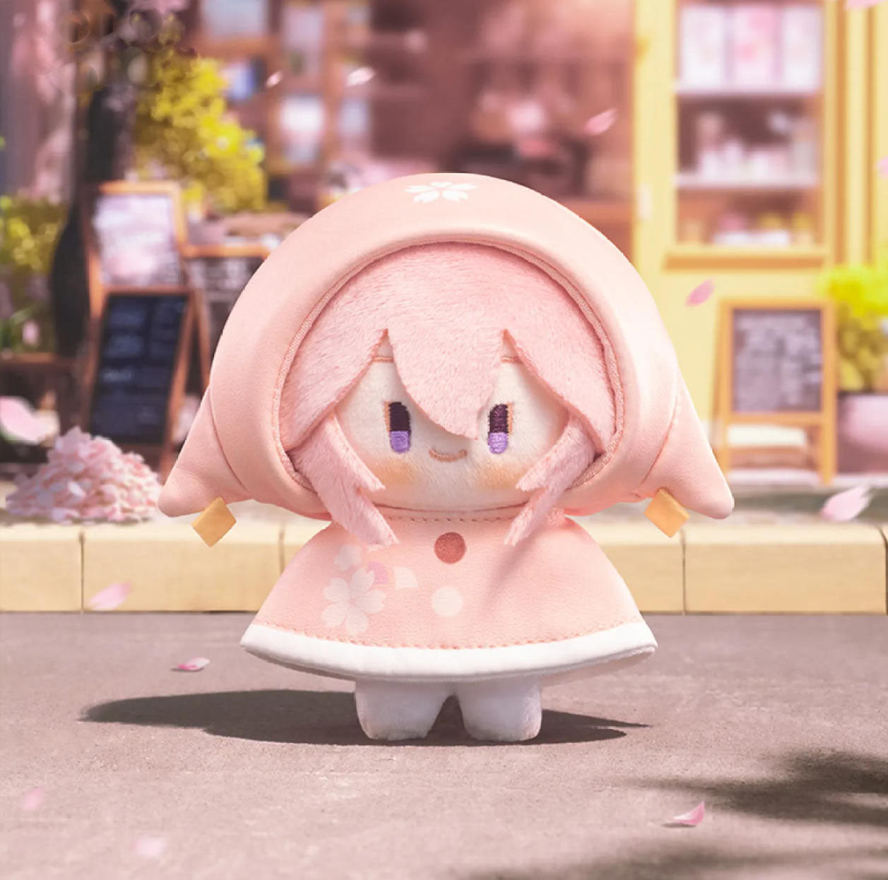 This plush charm shows Yae Miko in a pink cherry-blossom raincoat, her pink hair and playful purple eyes capturing her mischievous, elegant charm.