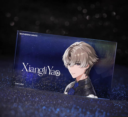 This 140×80×10mm acrylic block features Xiangli Yao from Wuthering Waves, with his blonde hair against a deep blue, starry holographic backdrop. The glitter adds a celestial shimmer.