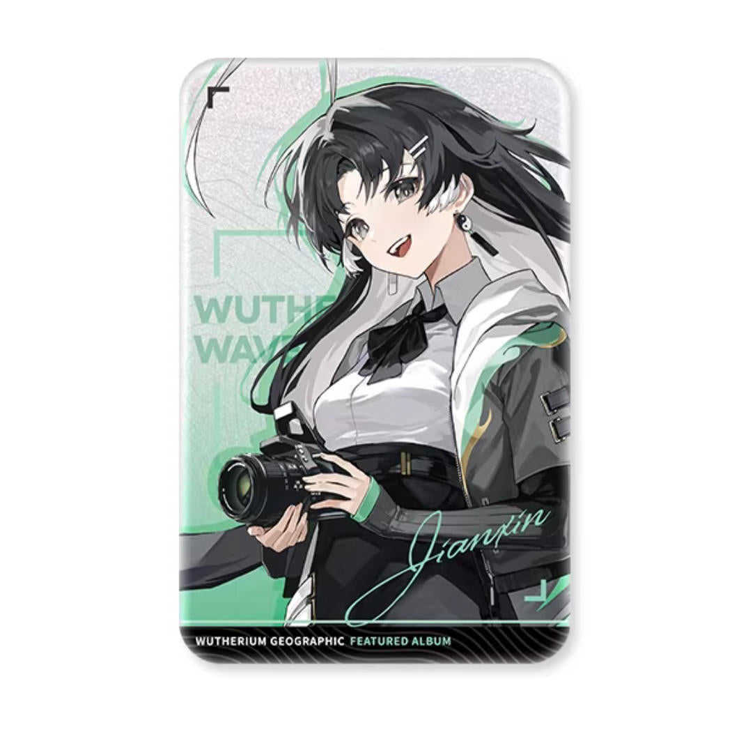 This 55×85mm tinplate card showcases Jianxin from Wuthering Waves, with her dynamic green and black outfit against a holographic pearl blue base, highlighting her energetic design.