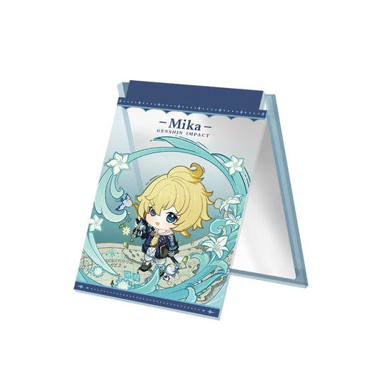 Chibi-style acrylic folding mirror featuring Mika, with a teal and blue floral wave design. The mirror unfolds into a stand, displaying the character’s name at the top against a plain light pink background.
