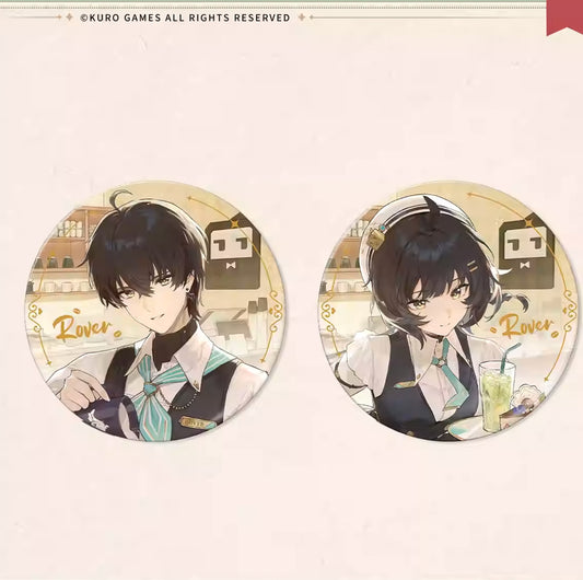 Two round, holographic badges featuring Rover from Wuthering Waves in café uniforms, placed on a white surface with a coffee jar in the background. Golden borders and the "Rover" signature add a refined touch.