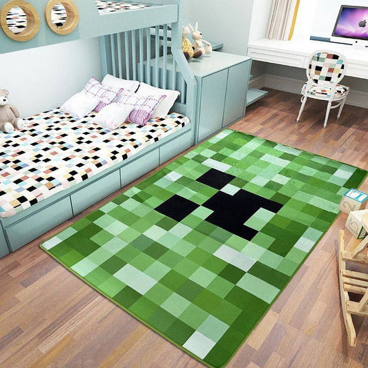 Green pixel-style Creeper carpet with a square face design, displayed flat on a dark marble surface for home floor decor.