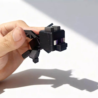 A detailed 3D figurine of the Ender Dragon Hatchling from Minecraft, featuring blocky purple body and wings with distinct pixelated eyes.
