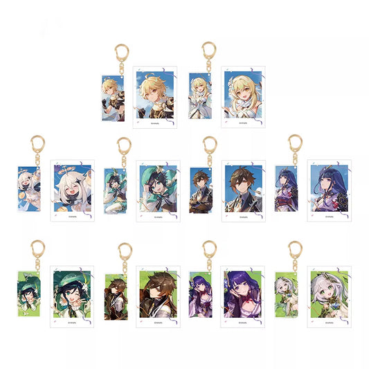Each keychain has a golden metal ring and a rectangular charm with a different character illustration. The characters have various hairstyles and outfits, with backgrounds in colors like blue and green. 