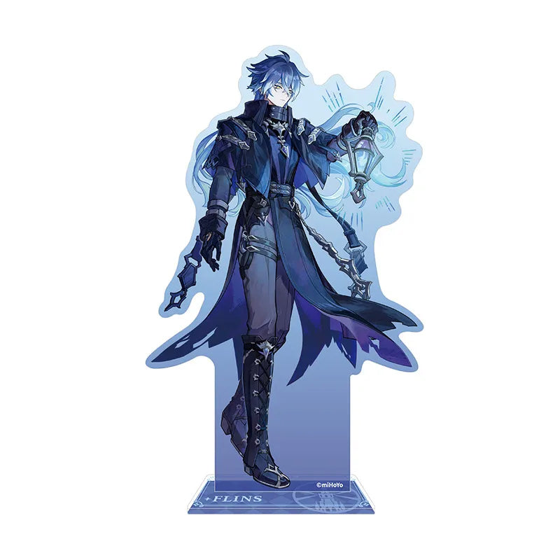 An anime-style acrylic stand featuring a male character from Genshin Impact, dressed in an elaborate dark blue and purple outfit with flowing cloak details. The design includes delicate light blue energy accents behind the figure.
