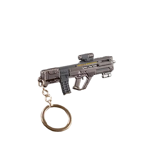 This is a detailed, miniature assault rifle keychain with a scope, tactical design, and metal keyring, perfect for collectors and military enthusiasts.