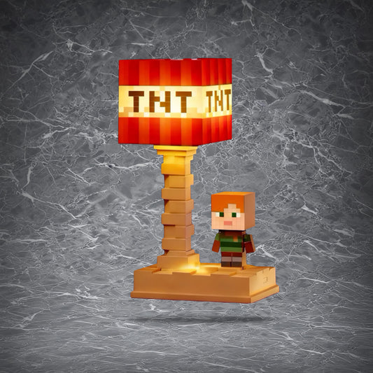 Minecraft-themed pixel block desk lamp with a square shade featuring designs like TNT and Diamond Ore, glowing softly on a nightstand.