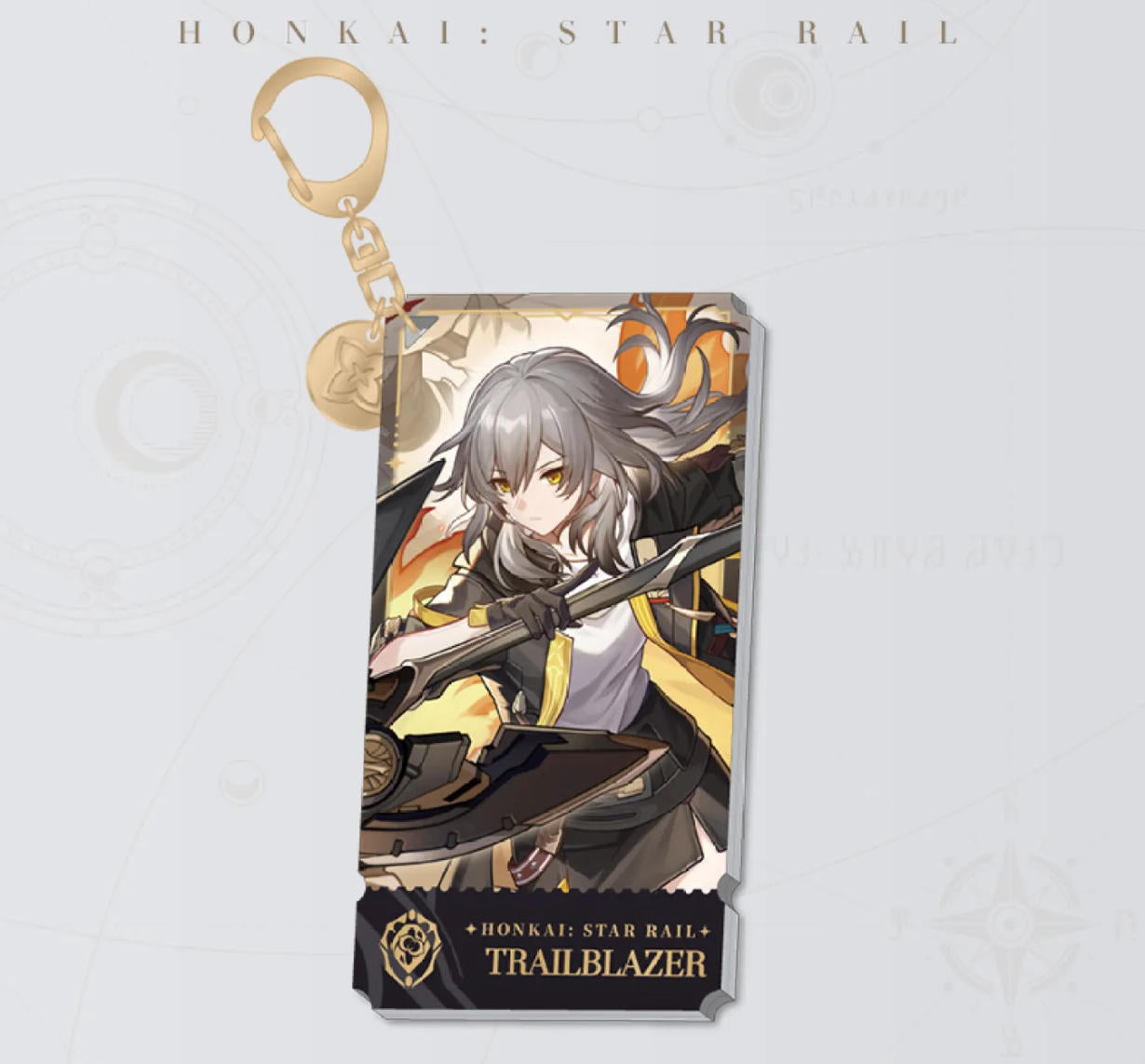 This Honkai: Star Rail acrylic keychain features the female Trailblazer in a fierce combat stance, with a golden clasp and chain, set against a fiery orange and gold backdrop.