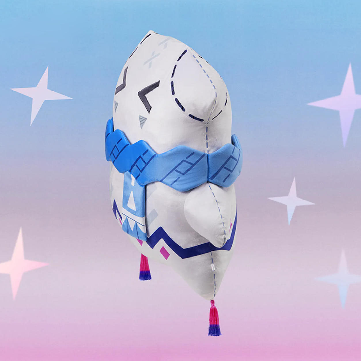 A side profile of the Citlali plush highlights its rounded, huggable shape, soft polyester texture, and playful tassels, emphasizing its cozy, collectible appeal.