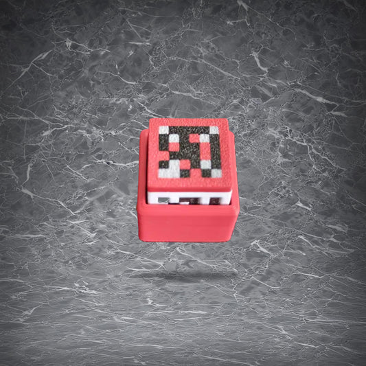 Minecraft-inspired pixel art fidget keychain with a mechanical keyboard switch button, shown in Creeper design.