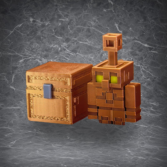 Copper Golem assembled model standing beside a copper chest, with block-style design and green eyes on a dark marble background.