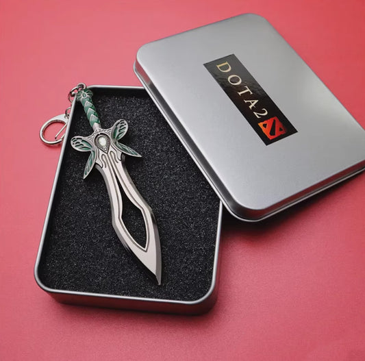 Mini Butterfly keychain, silver blade with green wing details, gem-adorned hilt, attached to a silver keyring, packed in a Dota 2 tin box.