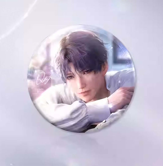 A close-up of a round badge featuring Qi Yu, resting his arms on a surface with a soft, hazy background and his signature script.