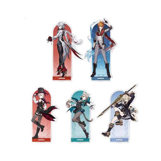 The image showcases five acrylic standing figures (badges) from the game Genshin Impact, each featuring a distinct character with unique designs and color schemes.