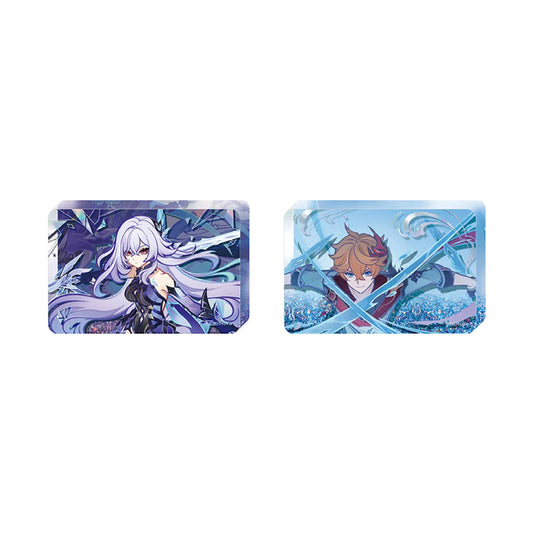 Two acrylic quicksand stands featuring vibrant anime-style artwork: one with a long silver-purple haired character set against a cosmic purple and blue background, and the other with a fiery red-haired character wielding hydro weapons on an icy blue dynamic backdrop.