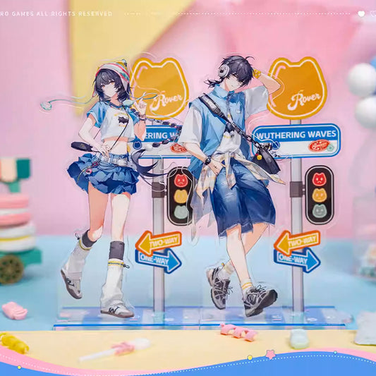 A paired acrylic standee set of the Male and Female Travelers from Wuthering Waves, showcasing their casual summer street style with traffic sign accents and a shared themed base.