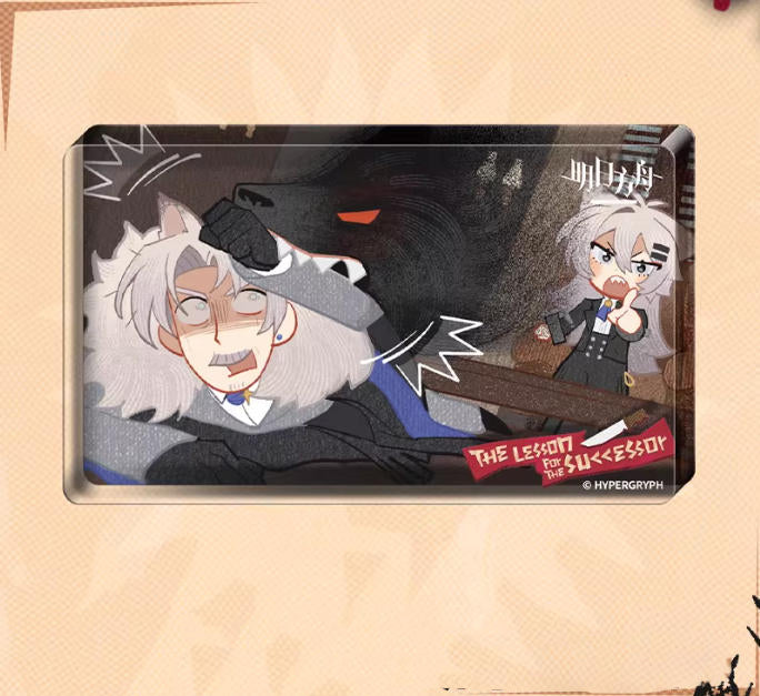 Acrylic block from Arknights' Heir's Compulsory Course event, set against a light peach background. The comic-style panel features a humorous interaction between two characters, with bold, expressive artwork and a red "THE LESSON" banner at the bottom, capturing the event's playful tone.