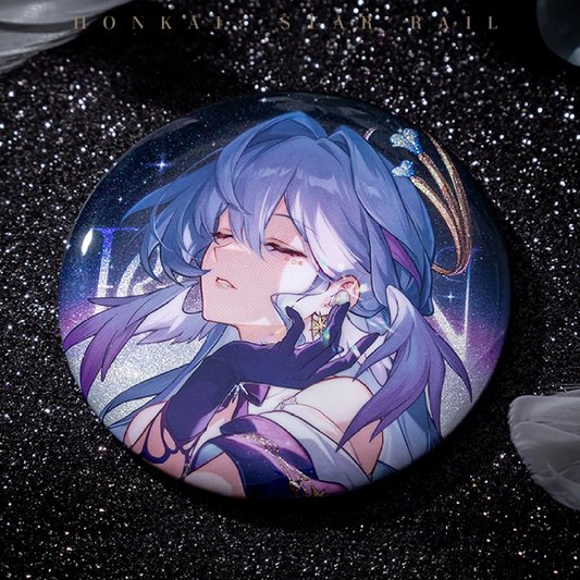 The Herta badge is showcased against a deep blue cosmic backdrop with shooting stars, resting on a reflective golden surface. Its silver glitter base shimmers, complementing Herta’s dreamy, closed-eye expression and flowing purple hair.
