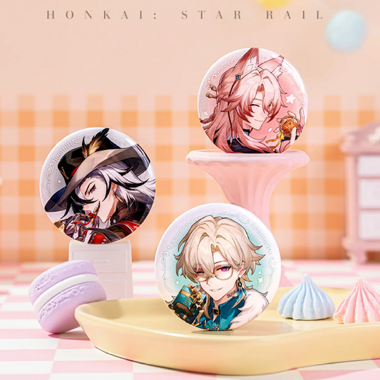 Three Honkai: Star Rail badges are showcased on a yellow tray with a macaron and meringue accents. 