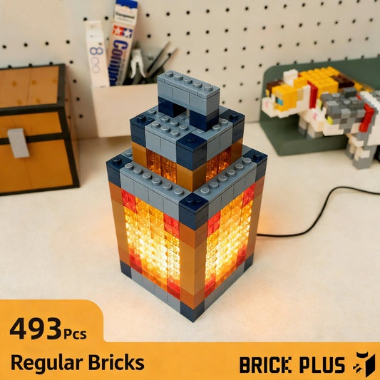 DIY Minecraft Lantern Night Light Kit, with 493 regular bricks. The assembled lantern features a glowing core, displayed on a desk with Minecraft-themed decor.