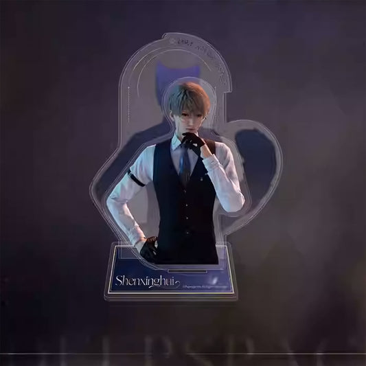 Acrylic standee of a blond male in a black vest, white shirt, and tie. He wears black gloves, with a hand to his mouth. A heart-shaped outline and "Shenxinghui" nameplate complete the design.