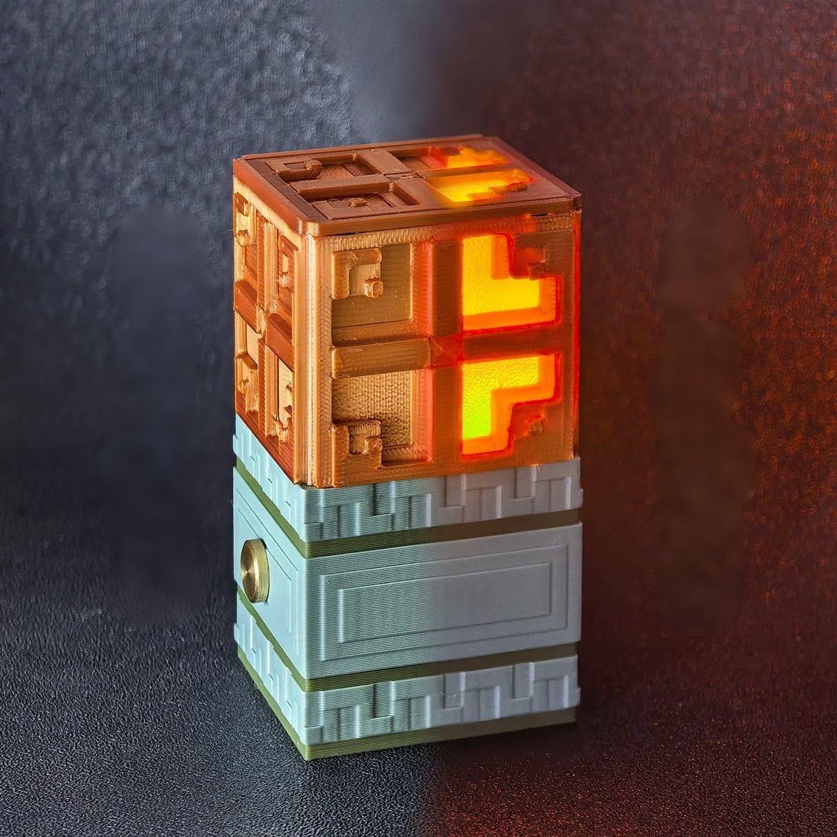 3D printed Minecraft Copper Bulb night light featuring glowing orange pixels and a grey carved stone base.

