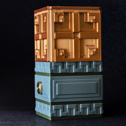 3D printed Minecraft Copper Bulb ornament with a copper top, grey tuff base, and circular gold touch sensor.
