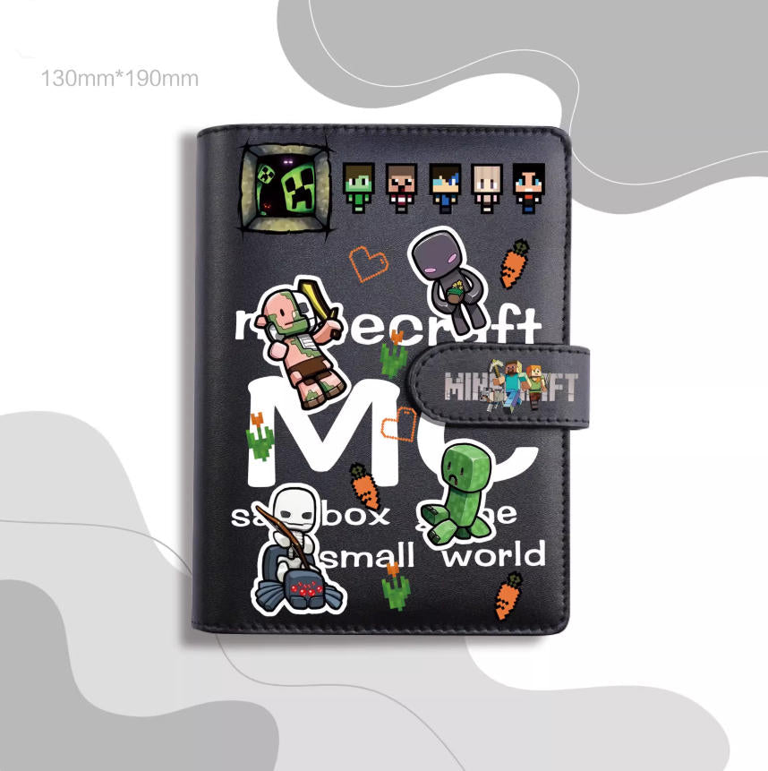 A stylish, dark-colored journal notebook with a PU leather cover, decorated with pixelated character stickers and playful text. The design features iconic game-inspired elements, set against a soft, abstract light pink background. 