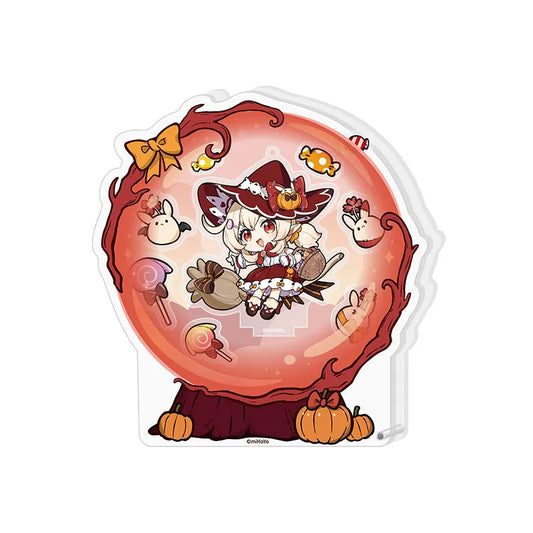 Night Reverie Series acrylic shaker stand featuring chibi-style Klee from Genshin Impact, set in a vibrant red, broken-glass effect frame with Halloween-themed confetti, pumpkins, and candy decorations, standing on a festive pumpkin base.