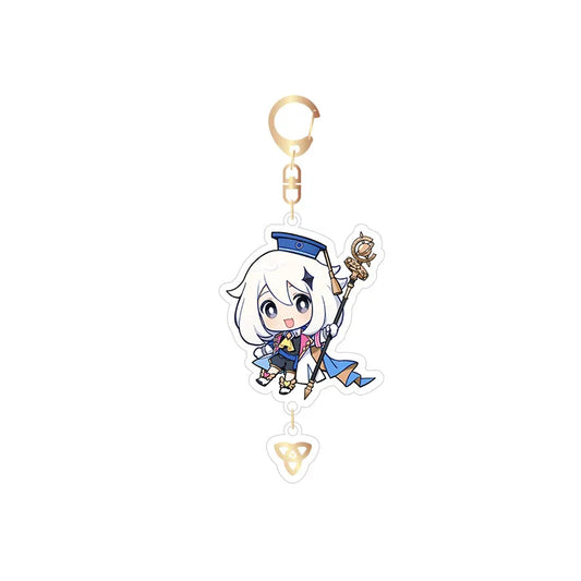 Genshin Impact 2023 Offline Event Acrylic Keychain featuring chibi-style Paimon, with a retro pop-art design, a matching elemental charm pendant, and a gold-toned keyring.