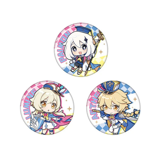 Set of three vibrant chibi-style character pins featuring colorful, checkered borders and bold name lettering: Paimon with a pink and blue background, Lumine with a pink and yellow backdrop, and Aether with a blue and yellow design, all printed on durable tinplate.