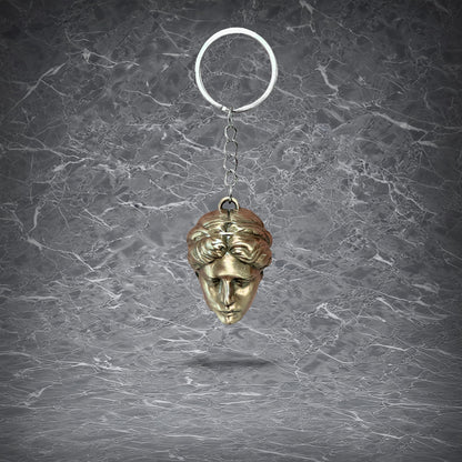 Path of Exile 2 Divine Orb keychain crafted from solid brass, featuring a detailed 3D casting of the iconic golden face currency item on a metal key ring.