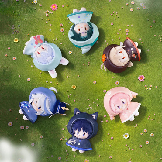 A group shot of all 6 “Rainy Day Frolic” plush charms on a flower-dotted grass field, featuring Xiao, Kazuha, Yae Miko, Furina, Wanderer, and Sigewinne in their themed raincoats