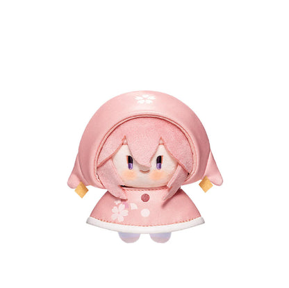 This plush charm depicts Yae Miko in a soft pink raincoat decorated with cherry blossoms, with her signature purple eyes and a warm, playful smile, perfectly embodying her mischievous charm.