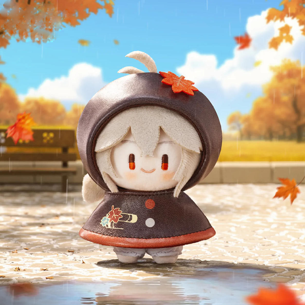This plush charm features Kaedehara Kazuha from Genshin Impact, wearing a deep brown raincoat with a maple-leaf hood. He stands in an autumnal, rain-slicked park, his gentle expression capturing his calm, poetic nature.