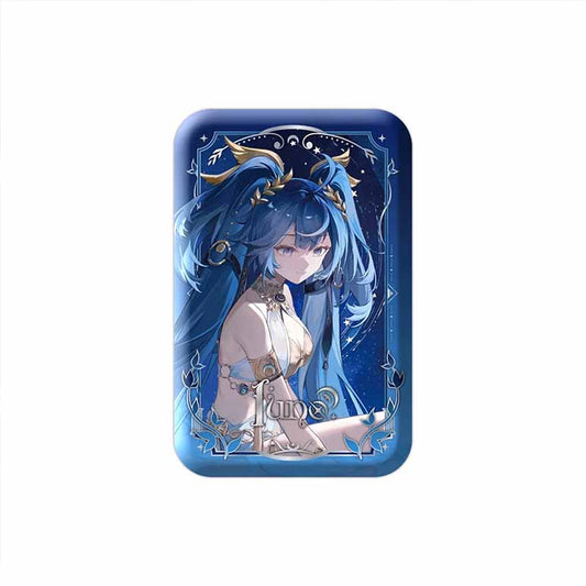 A rectangular tinplate badge of June, showcasing her flowing blue hair, celestial details, and a stylized name logo against a starry night sky with a blue foil border.
