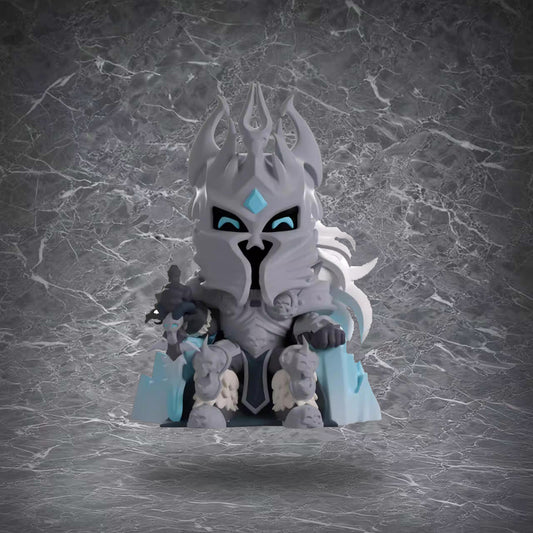 A chibi-style vinyl figure of The Lich King, featuring his iconic icy armor, glowing blue eyes, and regal crown. Crafted from smooth, high-quality vinyl, this compact collectible captures the character’s menacing charm. 