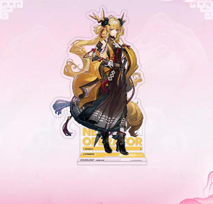 Acrylic standee of Thunderbolt Beeswax from Arknights, showcasing her flowing golden hair and dramatic dark outfit with a yellow "NEW OPERATOR" base, set against a pink backdrop.
